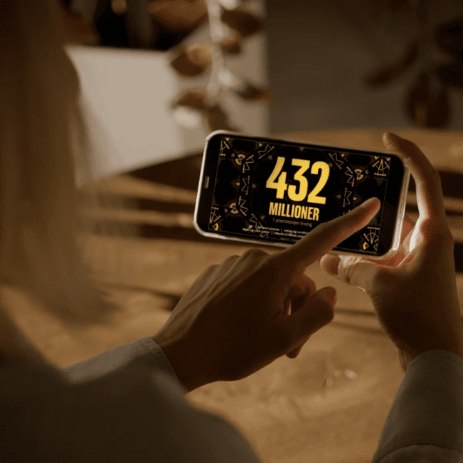 Danske Spil case study - a phone with a Danske Spil advertisement